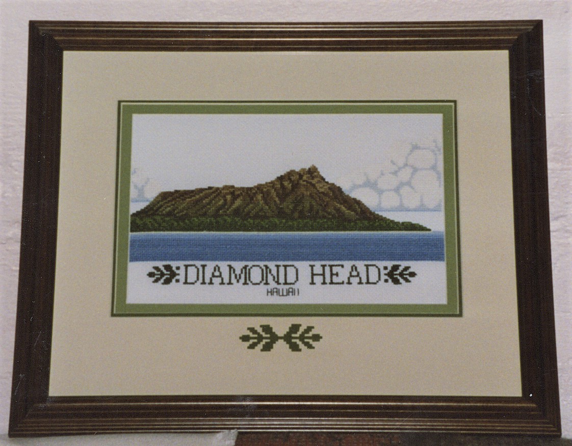 framed crosstitch of Diamond Head with embellished mat